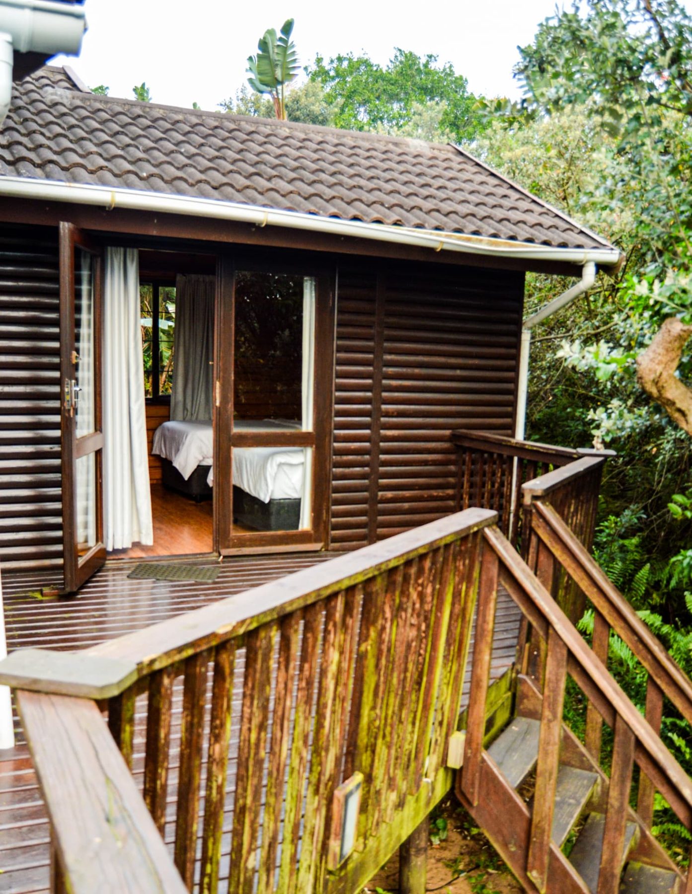 Deluxe Chalet deck with glass doors open to the bedroom